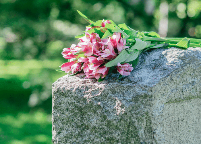 Flowers resting on a headstone