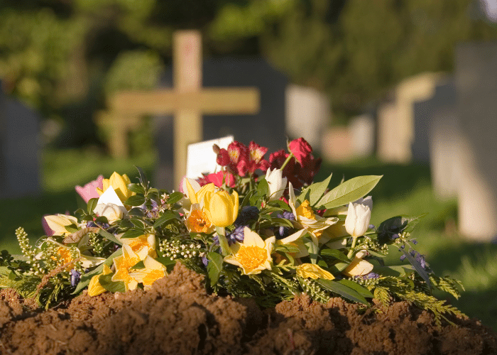 Flowers resting on a headstone