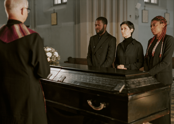 Family gathered around a casket