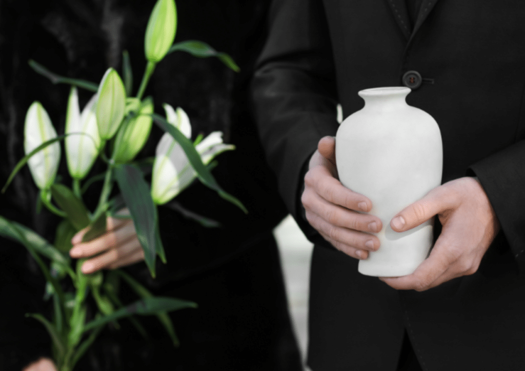 Mourners holding urn