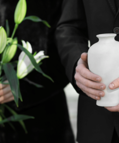Mourners holding urn